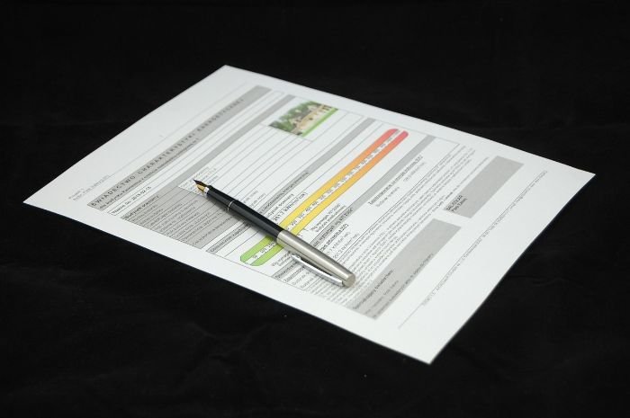 A pen resting on a professional certification document for cleaning services, highlighting the importance of hiring certified and insured cleaning professionals for quality assurance and customer peace of mind.